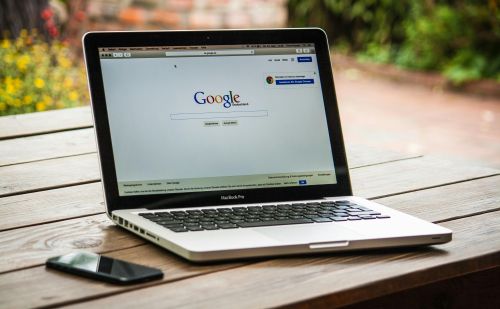 A laptop with the Google homepage open, symbolizing website creation and online presence