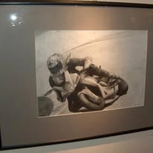 Graphite drawing of a motorcyclist in a sharp turn. Created at age 16 and selected for exhibition by his art teacher.