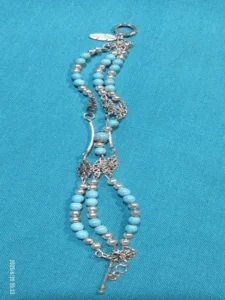 Triple-strand metal bracelet with turquoise beads Triple-strand metal bracelet with turquoise beads and unique ends