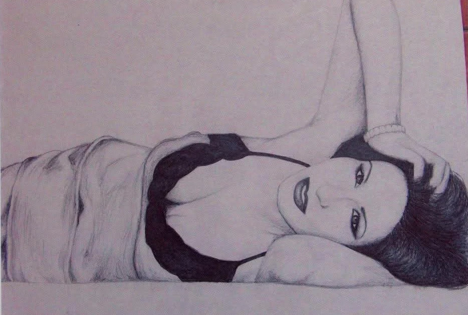 Graphite drawing of a reclining woman in a dress, with finely detailed face and hair. Drawn by my daughter at the age of 14.