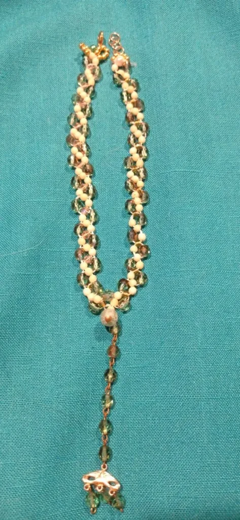 Handmade beaded necklace with white and clear crystal beads and copper wire components