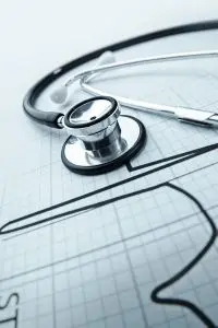A sztetoszkóp és az EKG-görbe szimbolizálja az orvosi pályát