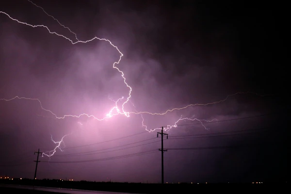 Purple lightning across a dark sky – metaphor for sudden insight