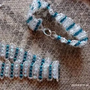 Handwoven necklace and bracelet set with turquoise and clear beads.