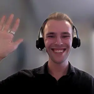 A young guy smiling with a big smile