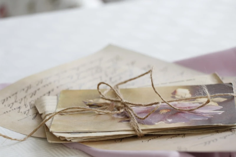 A bundle of old letters tied together with string. Atta's old, handwritten letters.