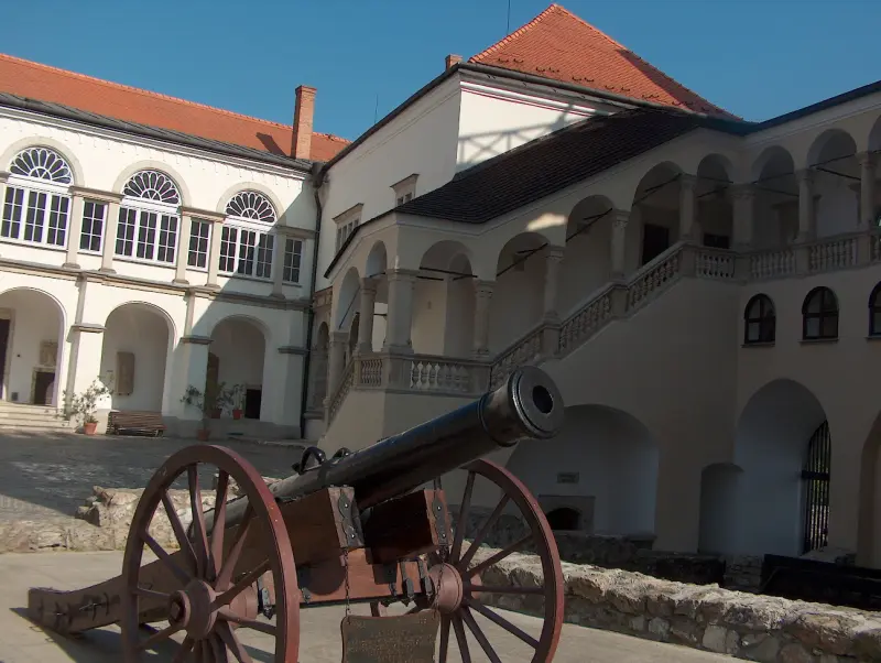 Displayed cannon in the castle courtyard in front of the Renaissance loggia