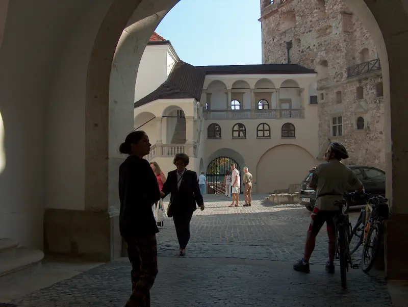 Renaissance loggia in the inner courtyard of Rákóczi Castle, with arches and balconies.